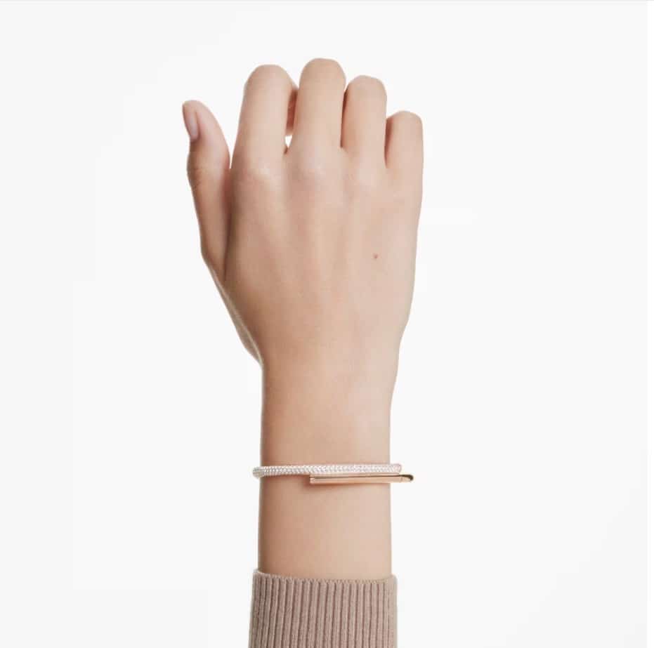 Swarovski Dextera white bangle with rose gold-tone plating and magnetic closure, stylish jewelry accessory.