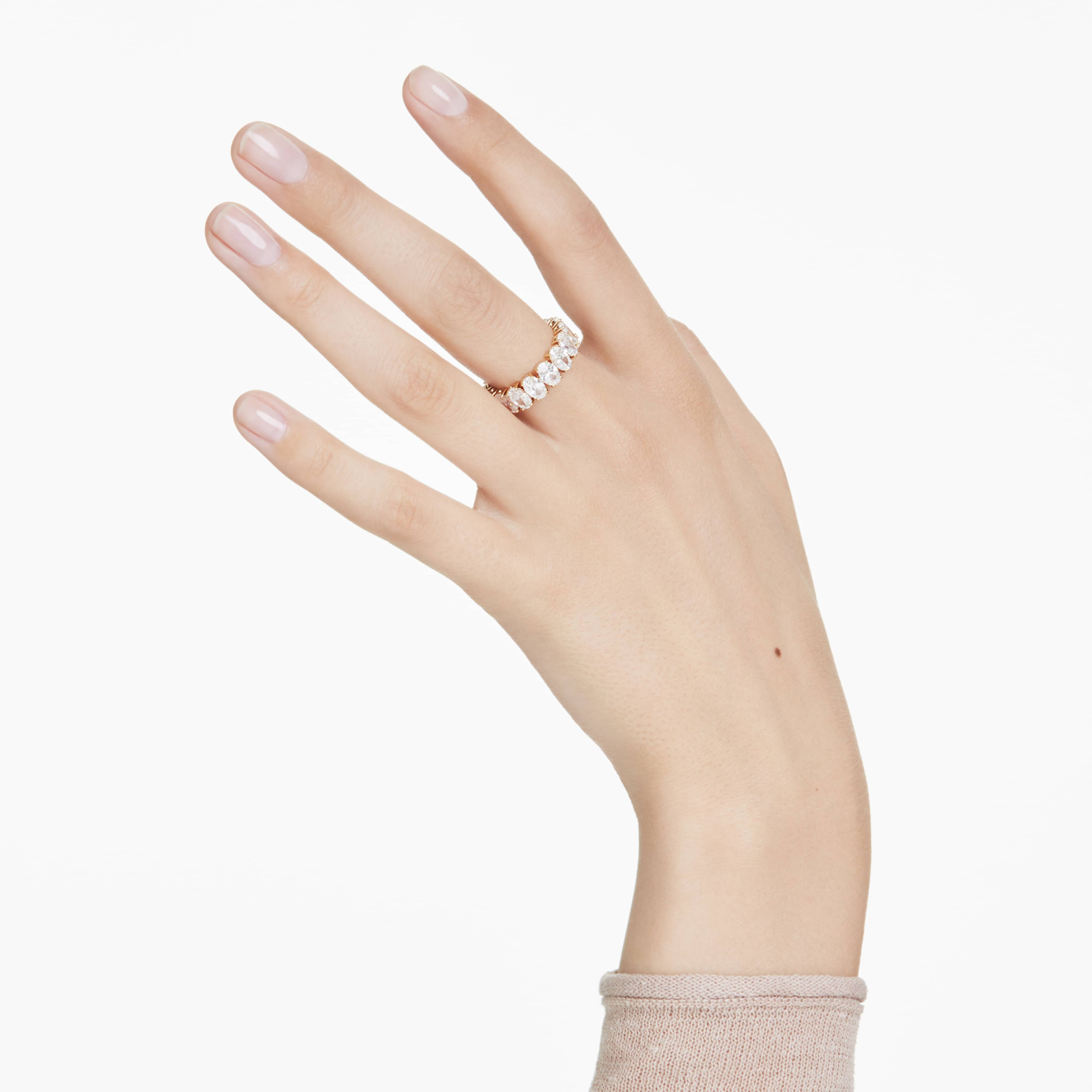 Swarovski Matrix ring with oval white crystal and gold-tone plating, featuring a sleek, modern design.