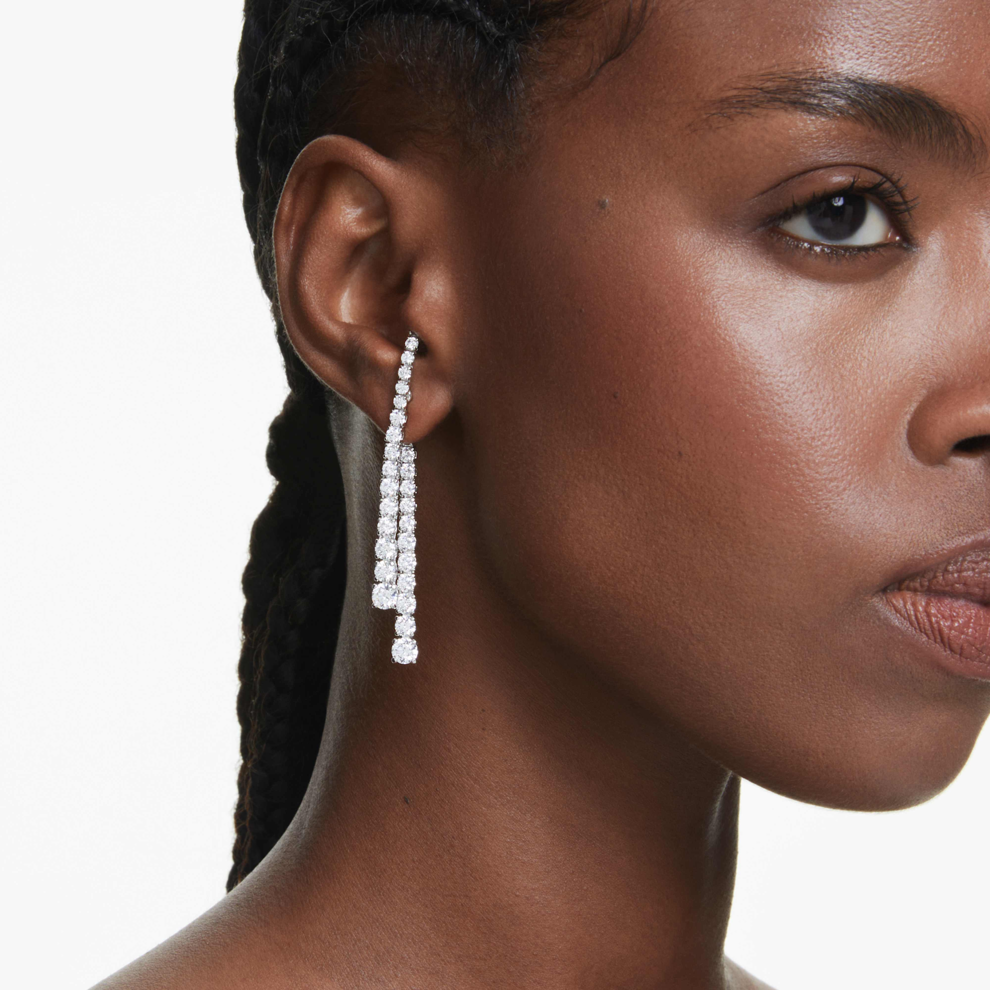 Swarovski Matrix Drop Earrings with white round-cut crystals in a gradient design, rhodium-plated for elegant sparkle.