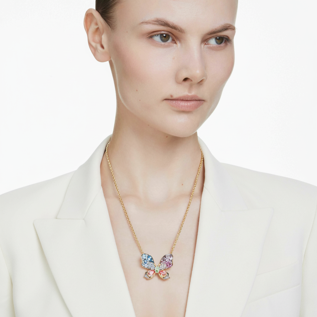 Swarovski Idyllia pendant and brooch with multicolored mixed cuts, pavé detailing, butterfly design, and mixed metal finish.