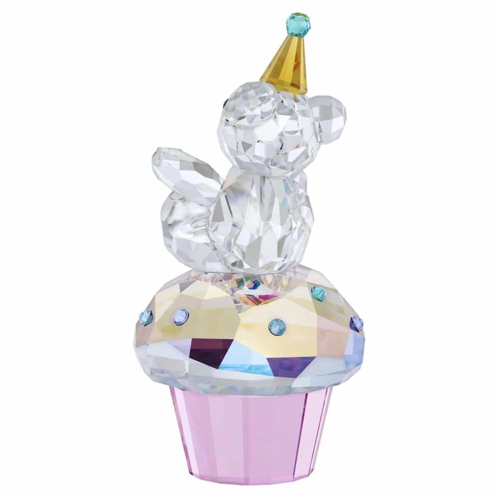 Swarovski Kris Bear Sweet Celebration figurine with clear crystal body, gold-tone accents, and playful bear design.