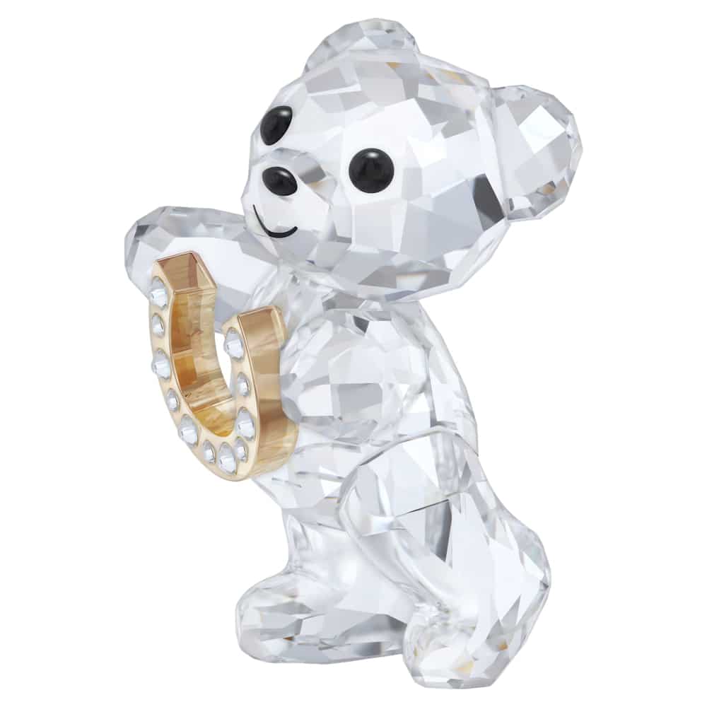 Swarovski Kris Bear figurine holding a gold horseshoe, sparkling crystal design, detailed craftsmanship, limited edition collectible.