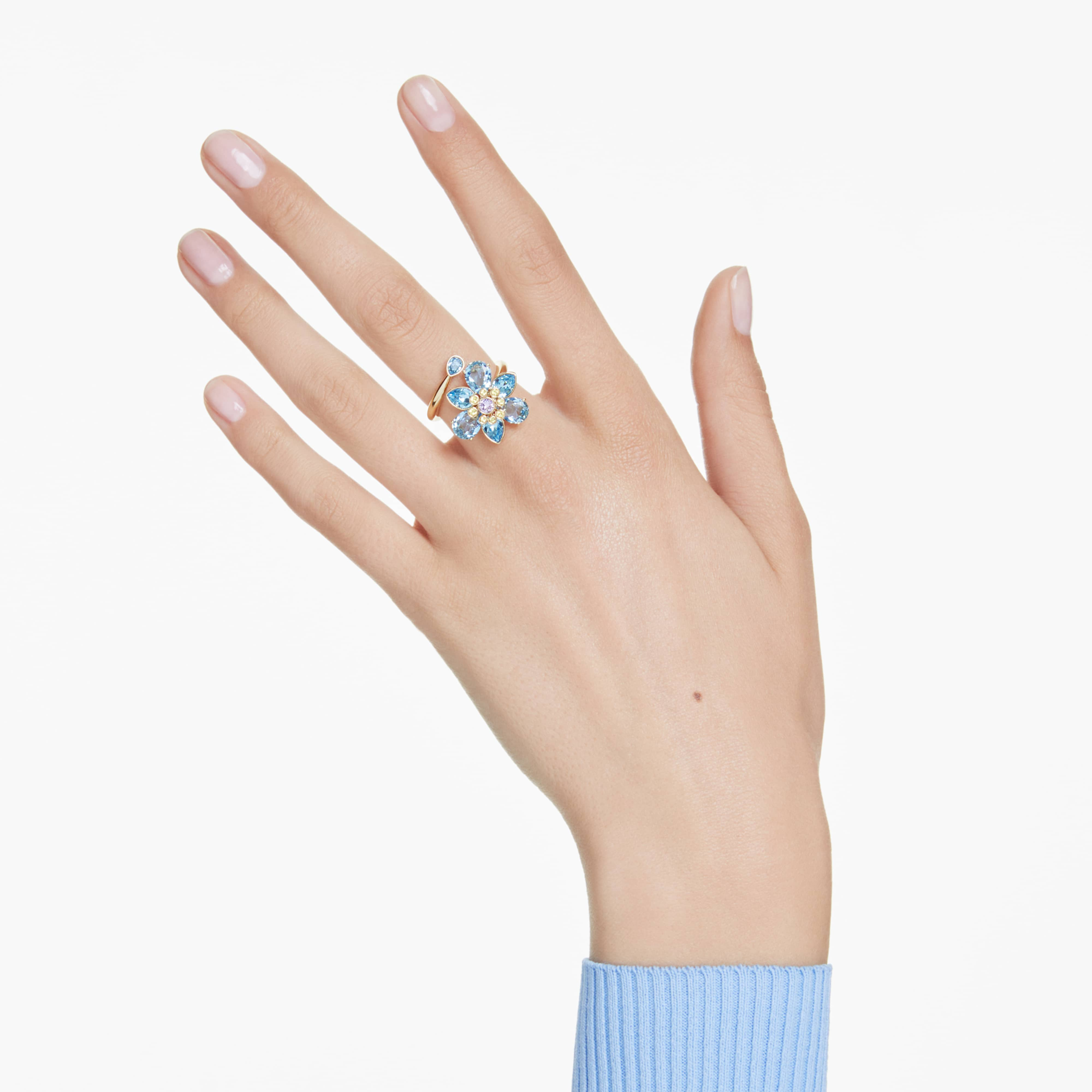 Swarovski Idyllia open ring with mixed-cut blue flower design, gold-tone plated jewelry accessory.