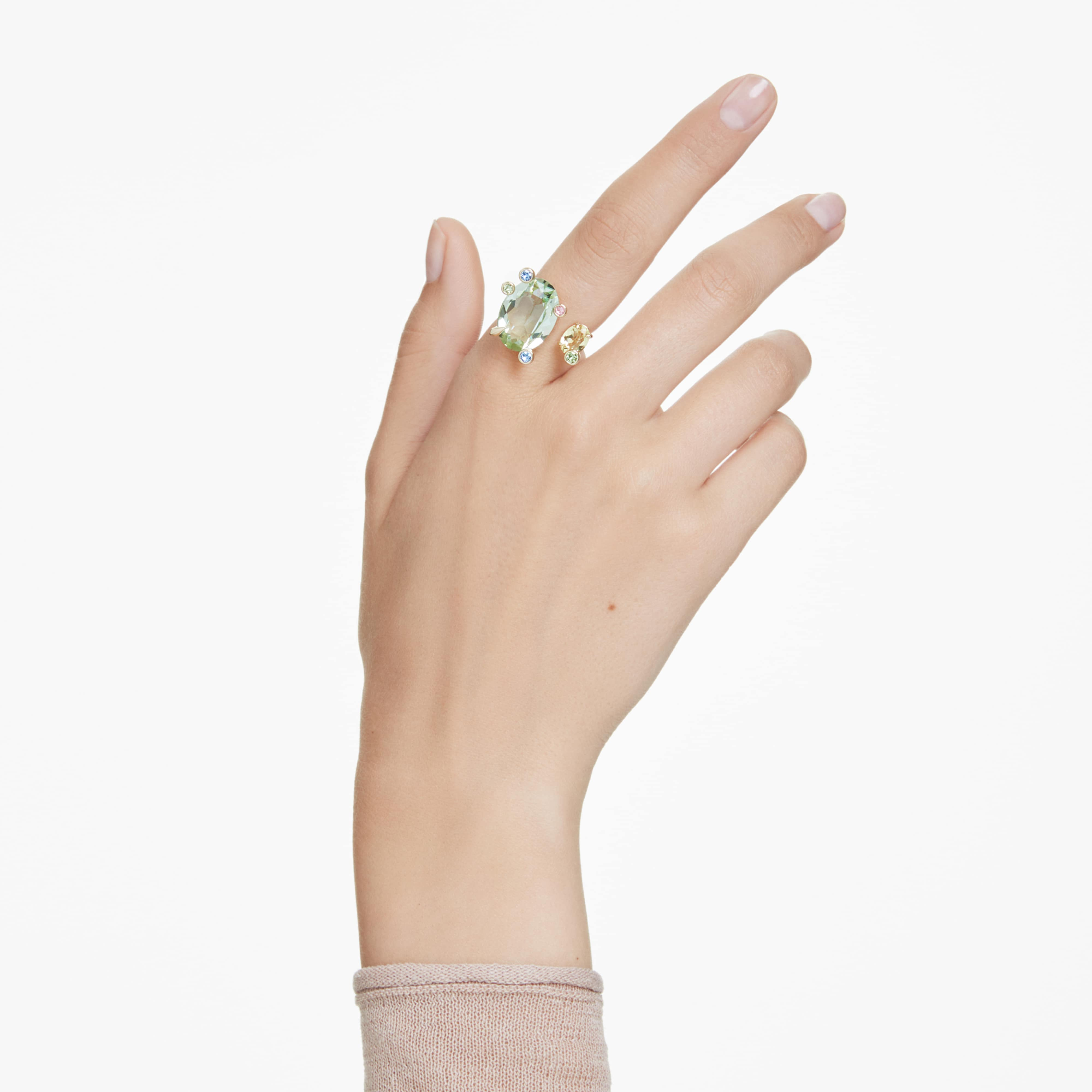 Swarovski Gema open ring with multicolored mixed-cut crystals and gold-tone plating, showcasing a stylish, modern jewelry design