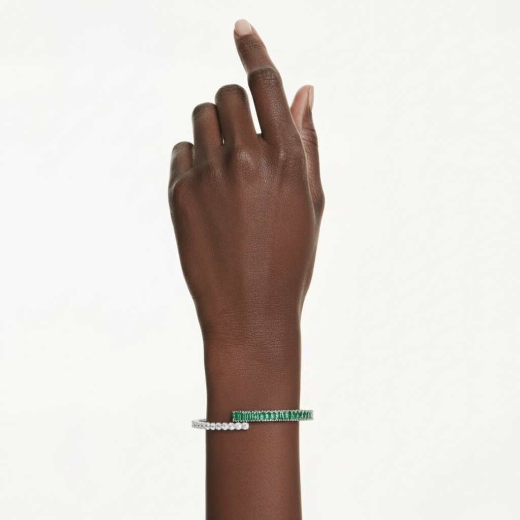 Swarovski Matrix Bangle featuring a sleek silver-tone design with sparkling crystal accents on a polished metal bracelet.