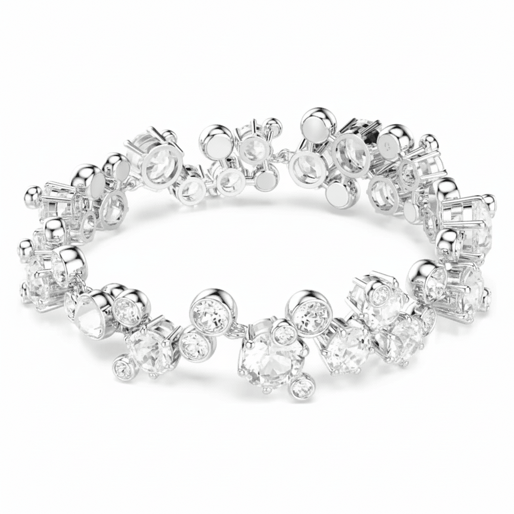 Swarovski Constella bracelet with mixed cut white crystals and rhodium plating, showcasing elegant jewelry design.