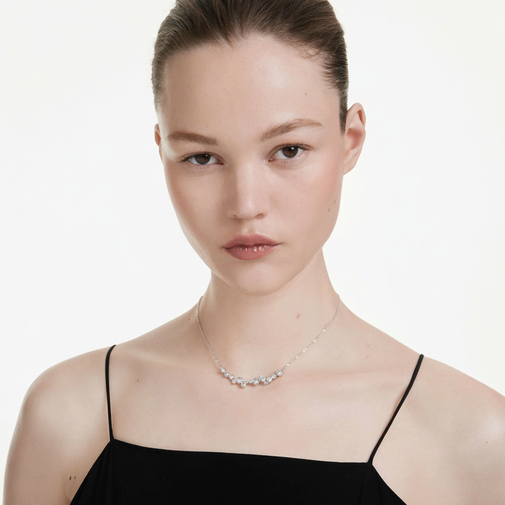 Swarovski Constella necklace with mixed-cut white crystals and rhodium plating, showcasing elegant jewelry design.