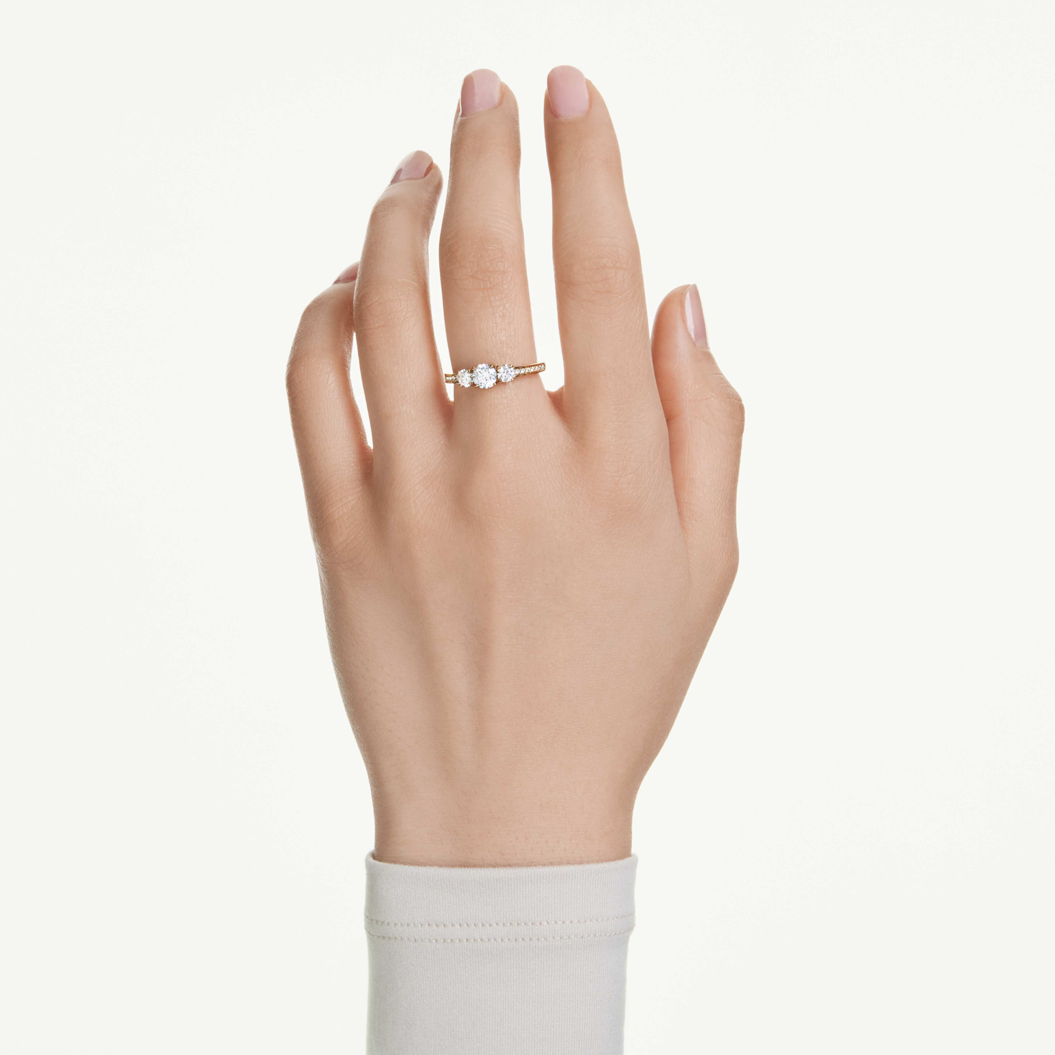 Swarovski Stilla Attract ring with round white crystal and gold-tone plating, elegant jewelry accessory.