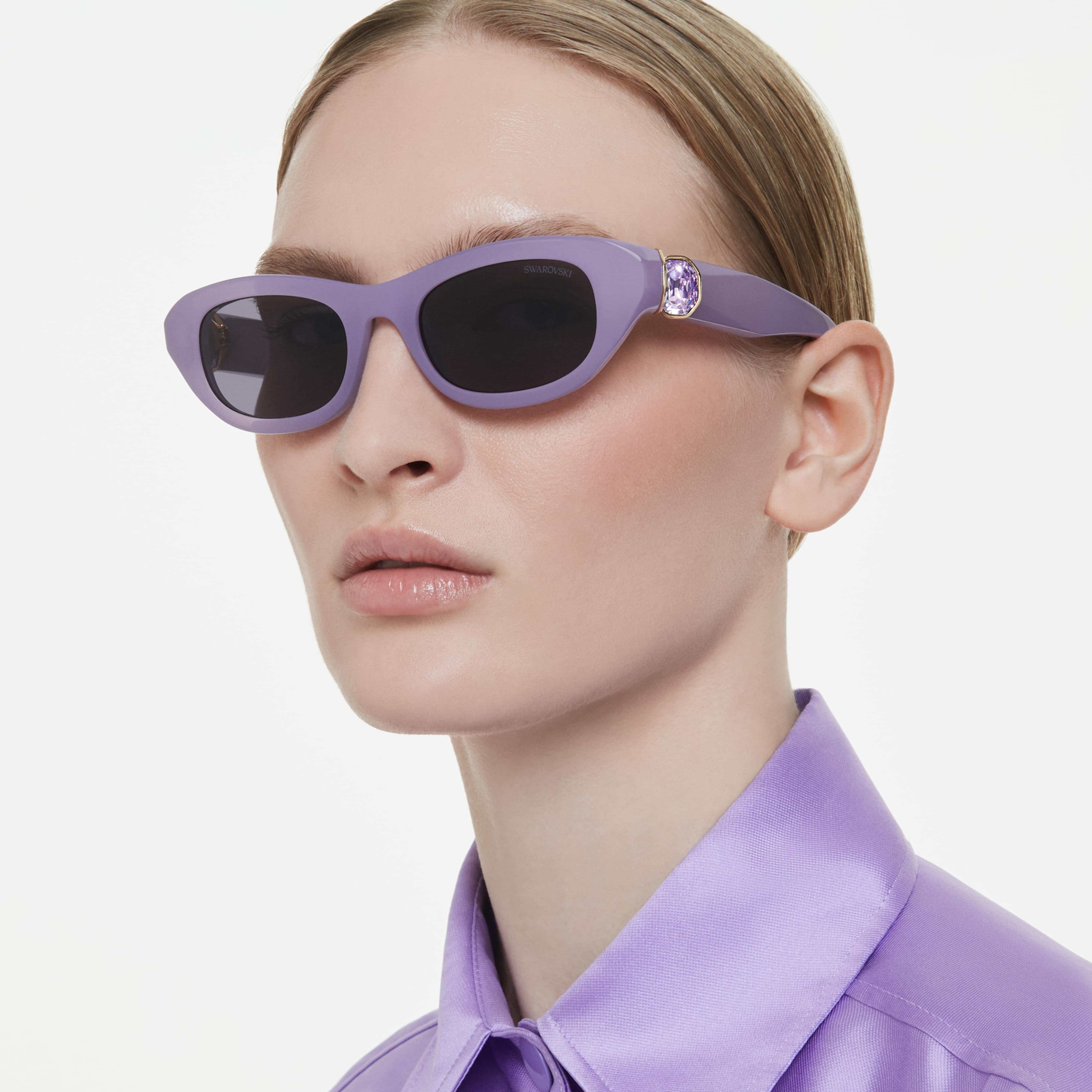 Swarovski purple pillow-shaped sunglasses with rounded lenses and sleek frame design, stylish eyewear accessory.