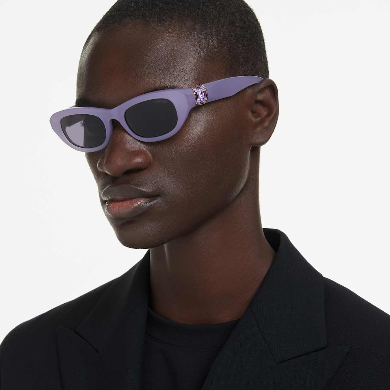 Swarovski pillow-shaped purple sunglasses with branded logo and sleek design, stylish eyewear accessory.