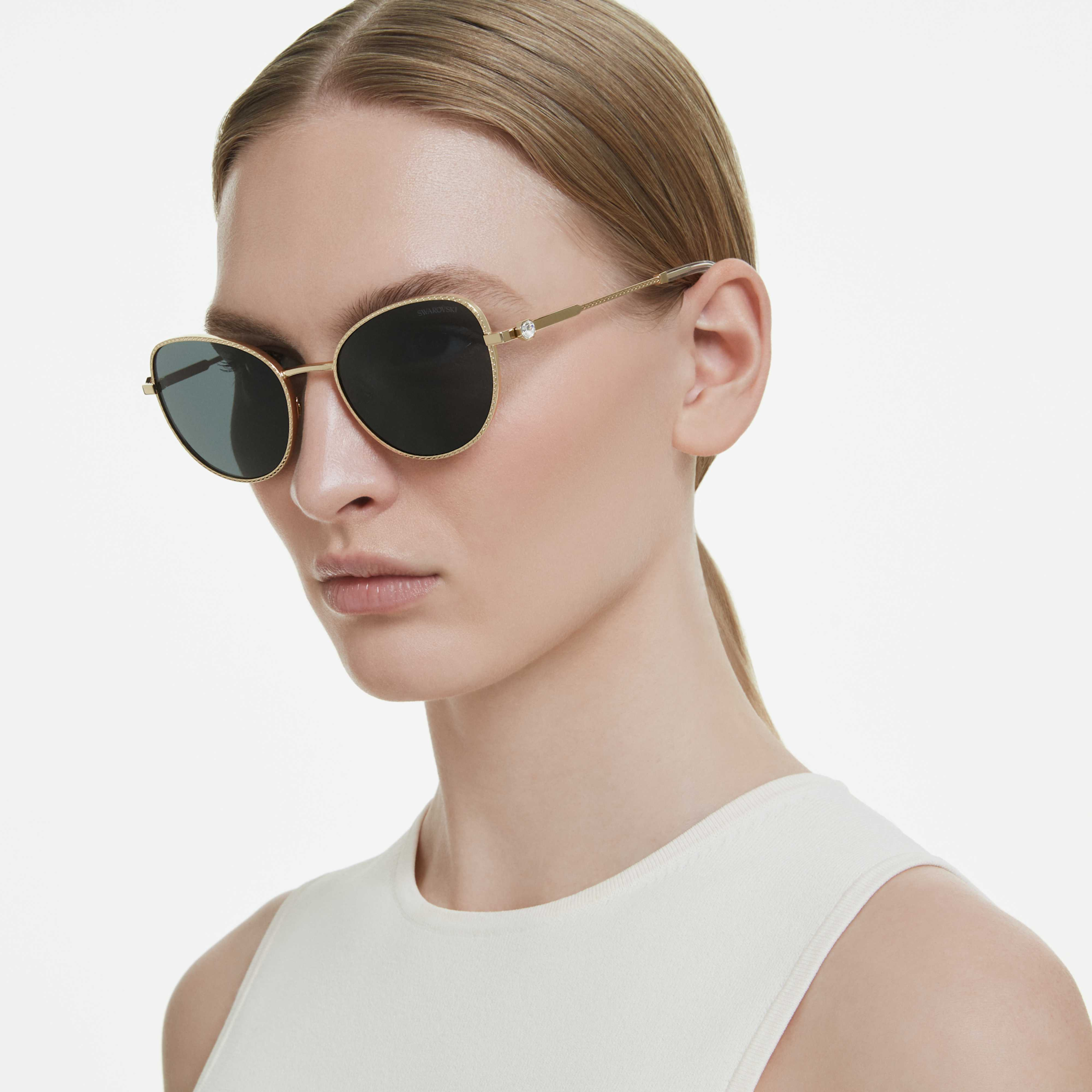 Gray Swarovski cat-eye sunglasses with sleek frame and stylish design, perfect for fashion-forward accessories.