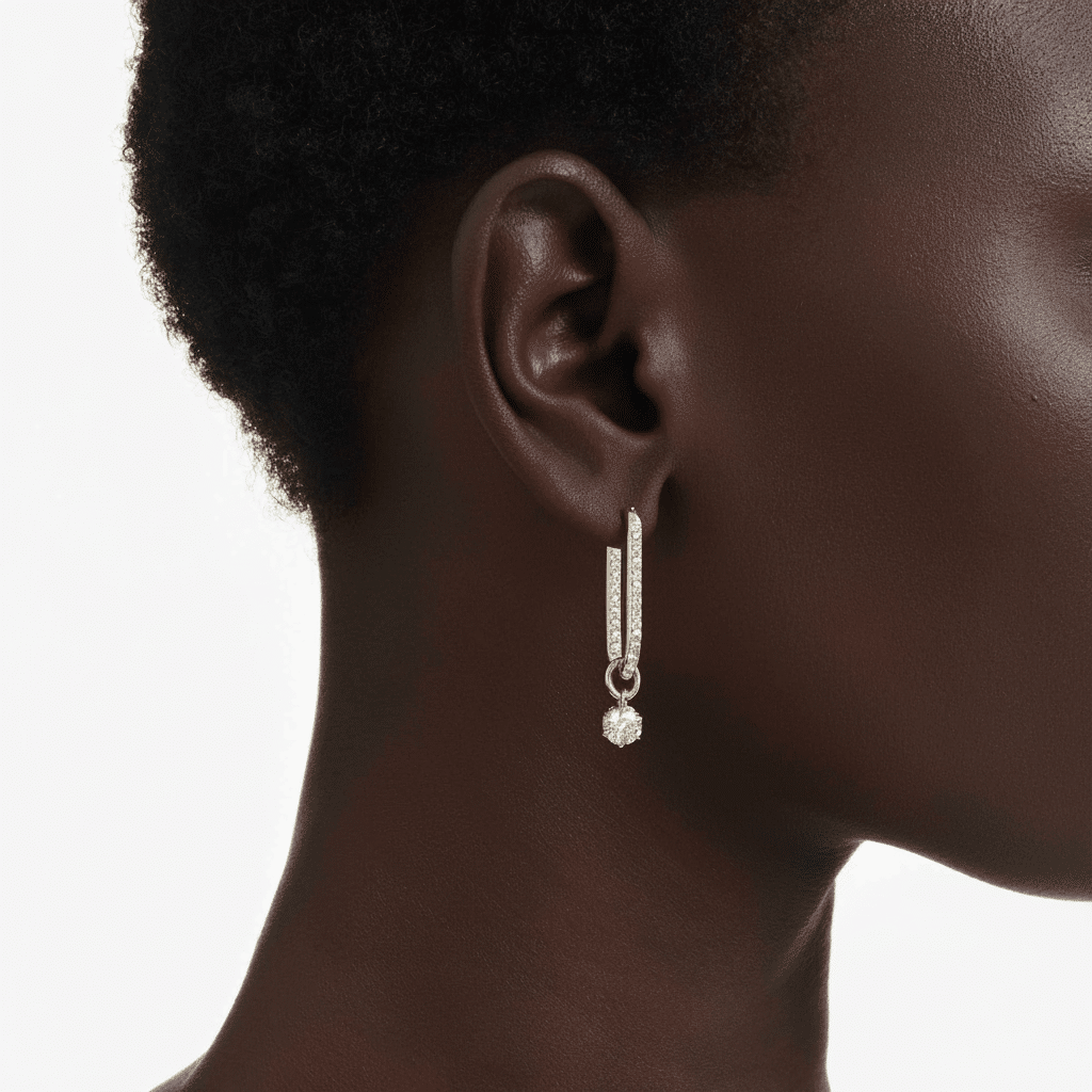 Swarovski Constella drop earrings with round white crystals and gold-tone plated setting, elegant jewelry for special occasions.