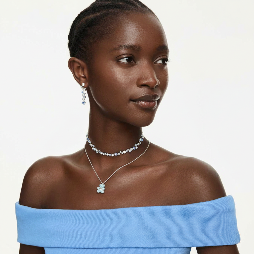 Swarovski Constella necklace with mixed cut blue crystals and rhodium plating, showcasing a sparkling, elegant jewelry piece.