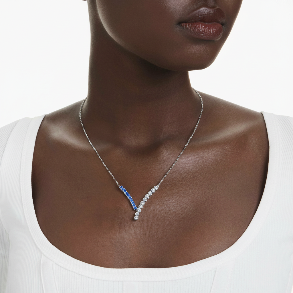 Swarovski Matrix pendant with mixed blue crystal cuts, rhodium-plated jewelry piece with intricate design and sparkling details.