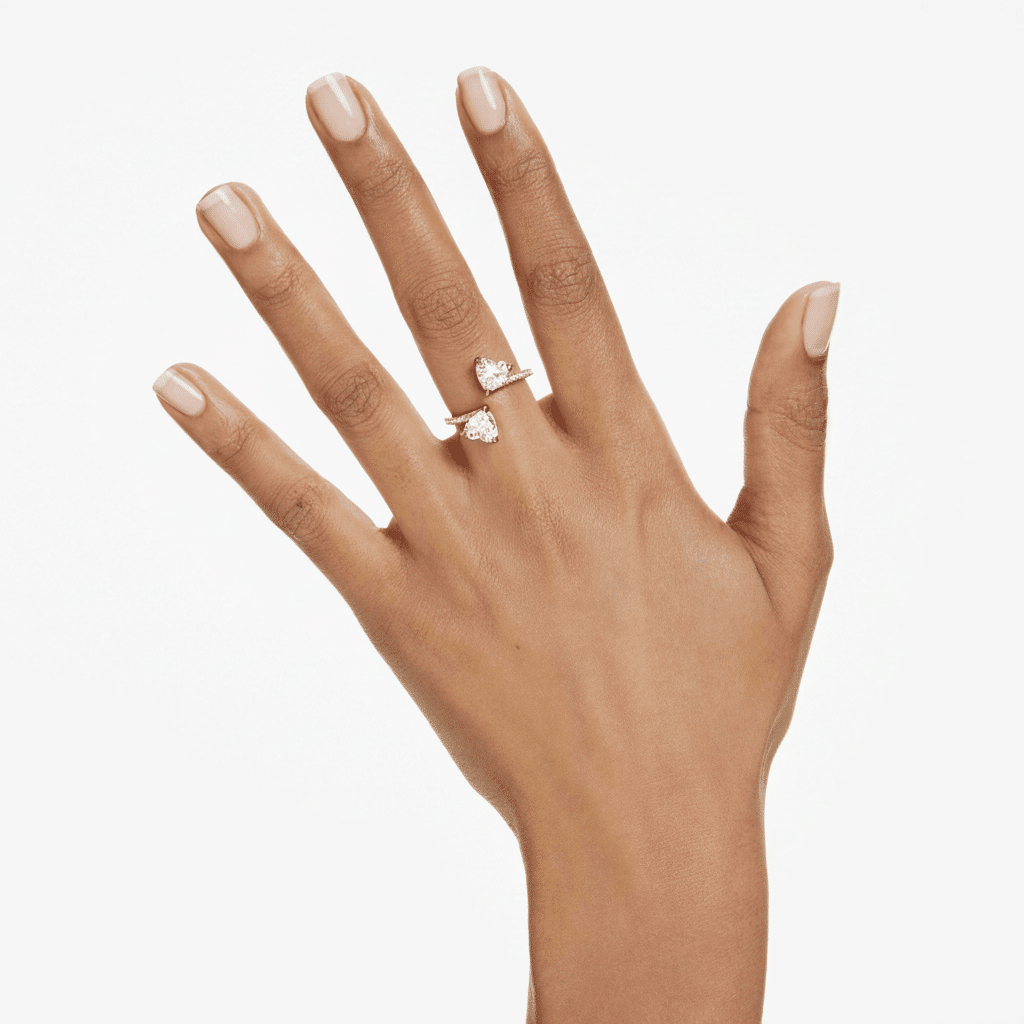 Swarovski Mesmera open ring with heart cut design, pavé accents, white stones, gold-tone plated jewelry piece.