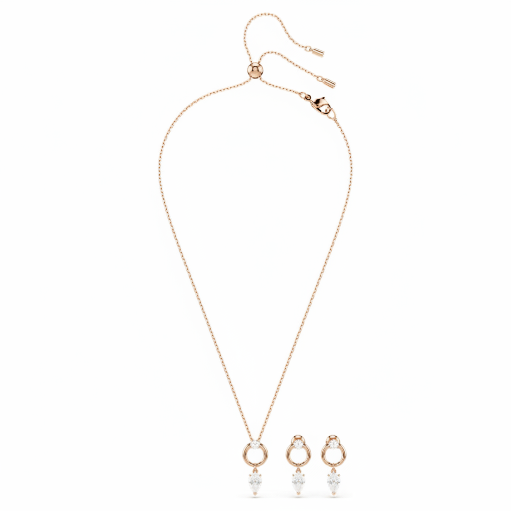Swarovski Mesmera jewelry set with pear and round cut white gemstones in rose gold-tone plating, elegant and sparkling.