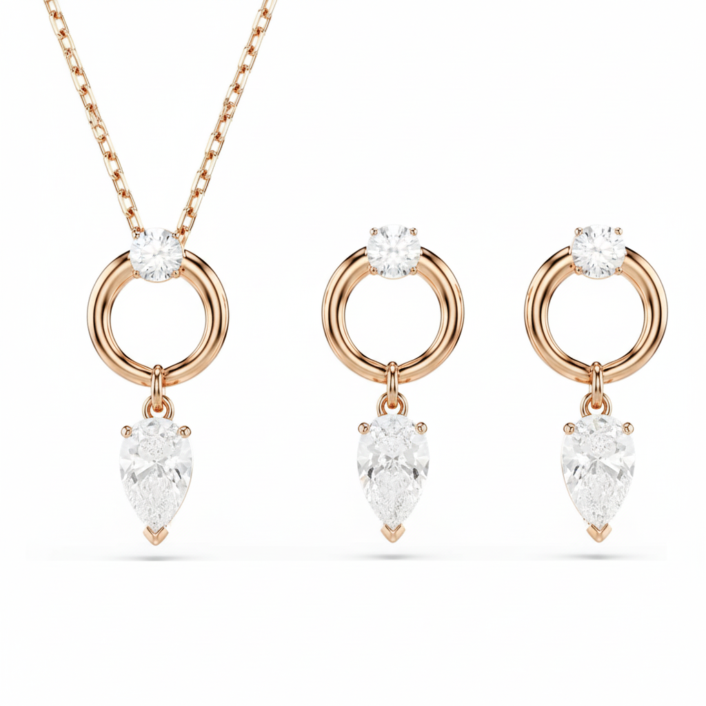 Swarovski Mesmera jewelry set with pear and round cut white crystals, rose gold-tone plated, elegant and sparkling.