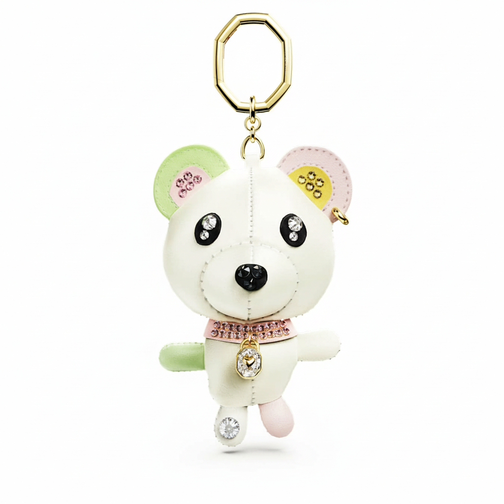 Swarovski Teddy bag charm bear with multicolored crystals and gold-tone plating, detailed and decorative accessory for bags.