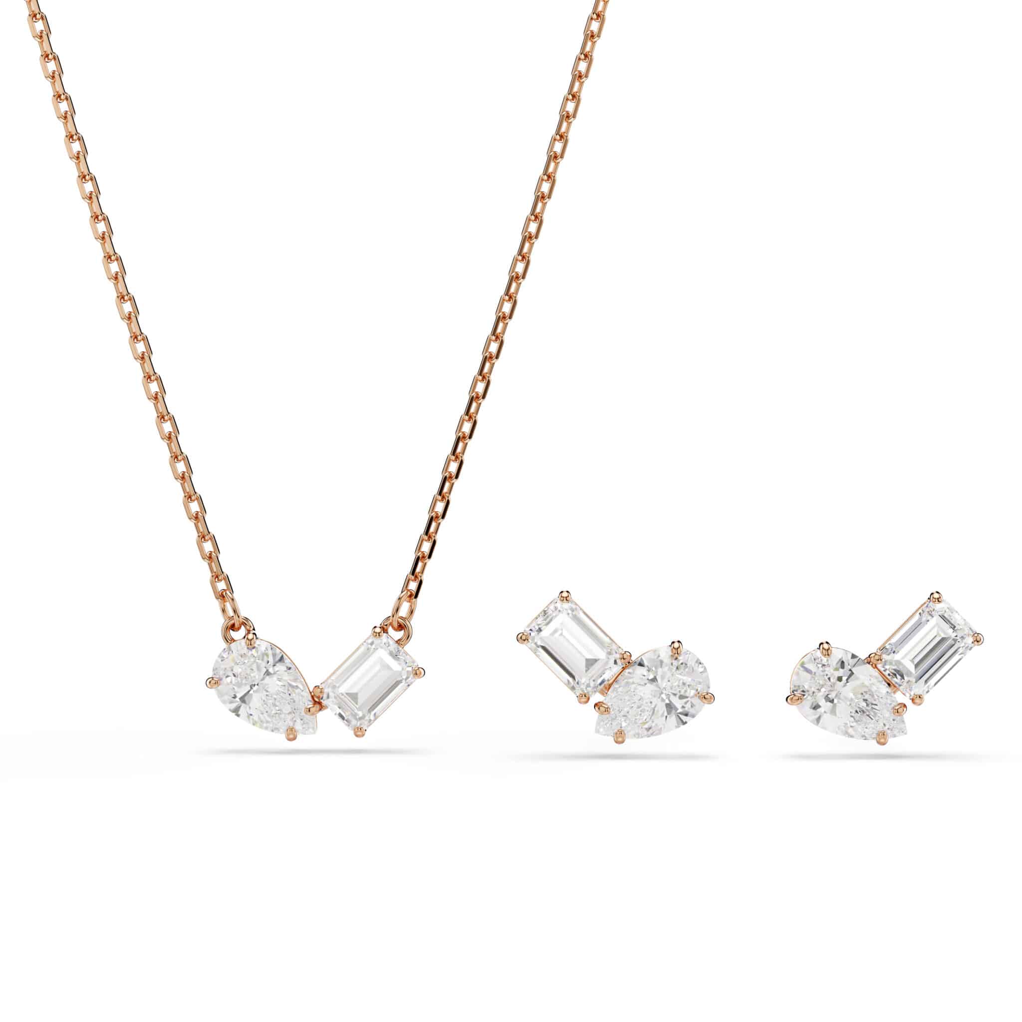 Swarovski Mesmera jewelry set with white stones and rose gold tone plating, including necklace and matching earrings.