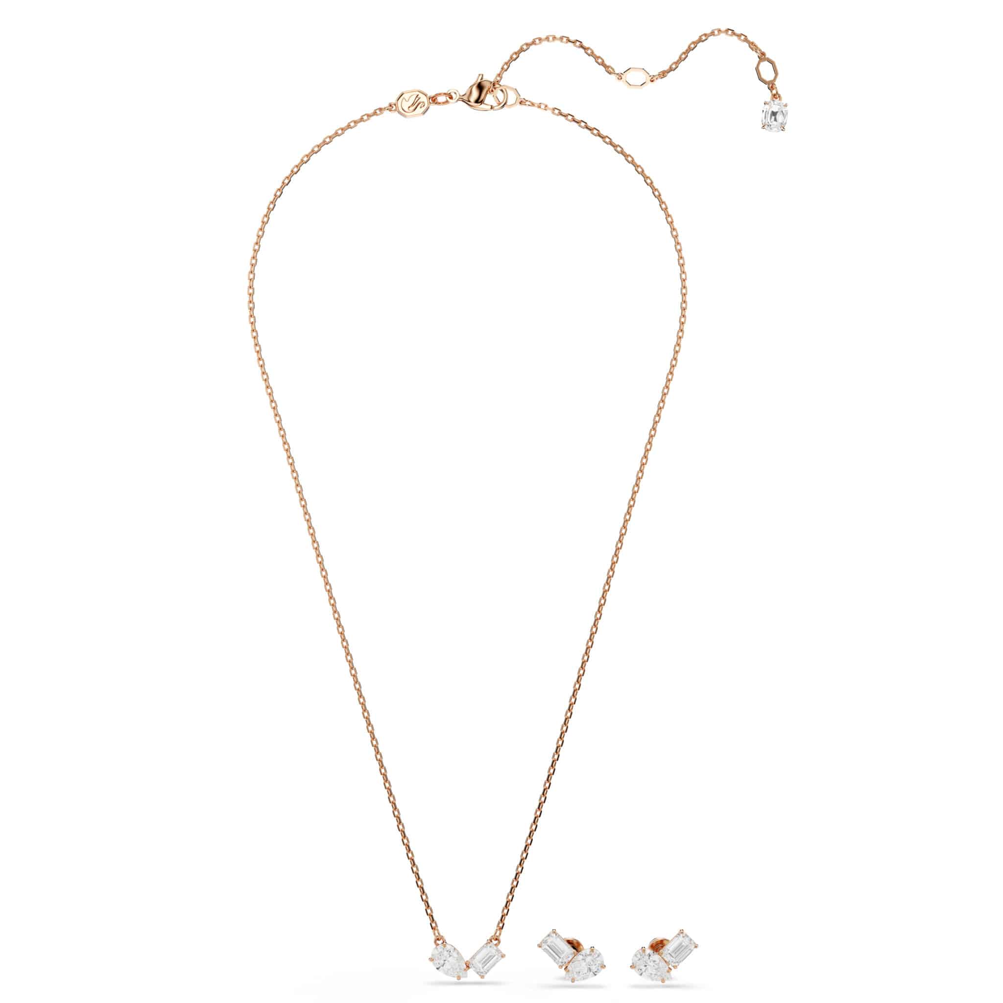 Swarovski Mesmera jewelry set with white stones and rose gold tone plating, featuring elegant necklace and matching earrings.