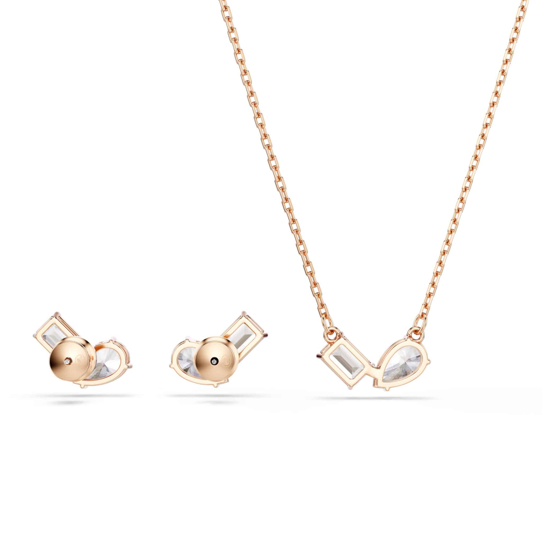 Swarovski Mesmera jewelry set with white stones and rose gold tone plated accents, featuring a necklace and matching earrings.