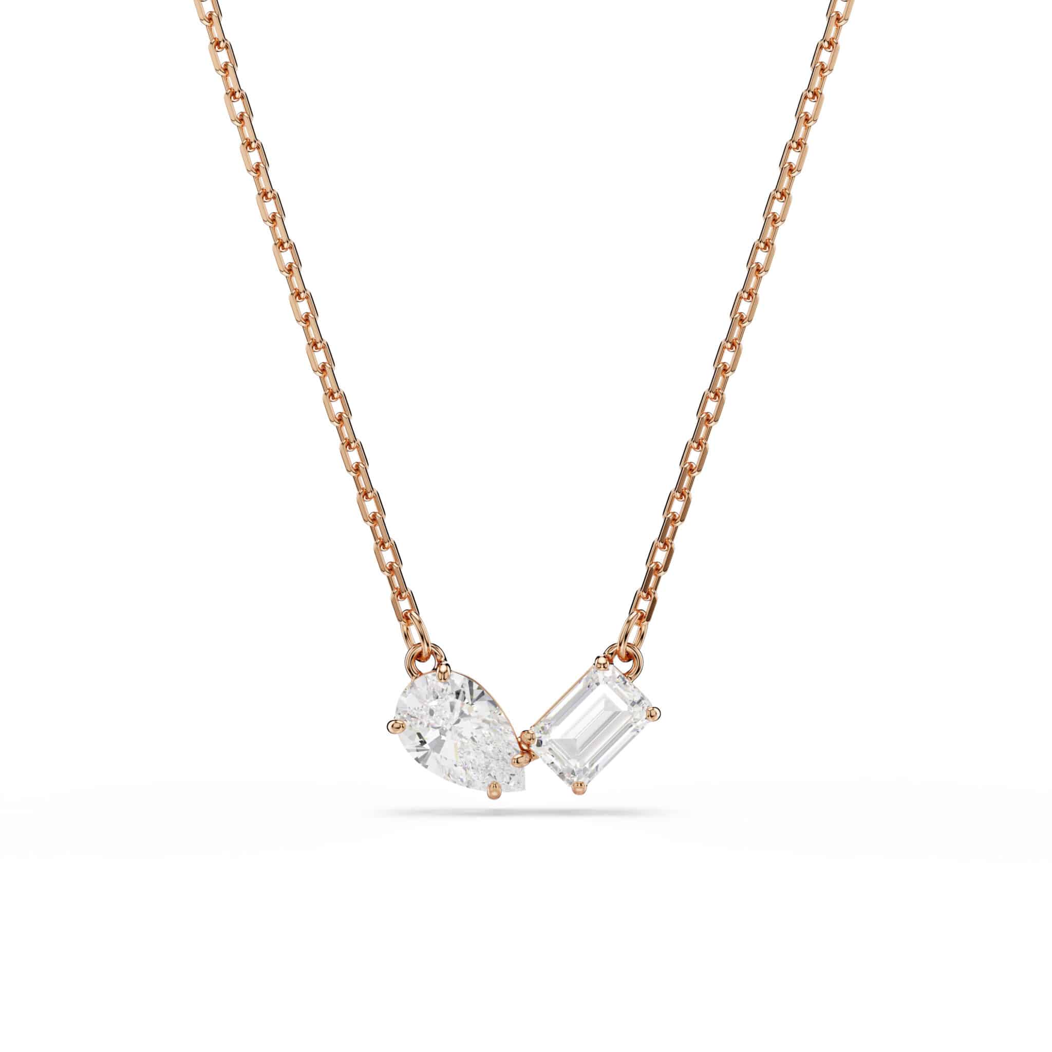 Swarovski Mesmera jewelry set featuring white stones and rose gold tone plating, includes necklace and matching earrings.