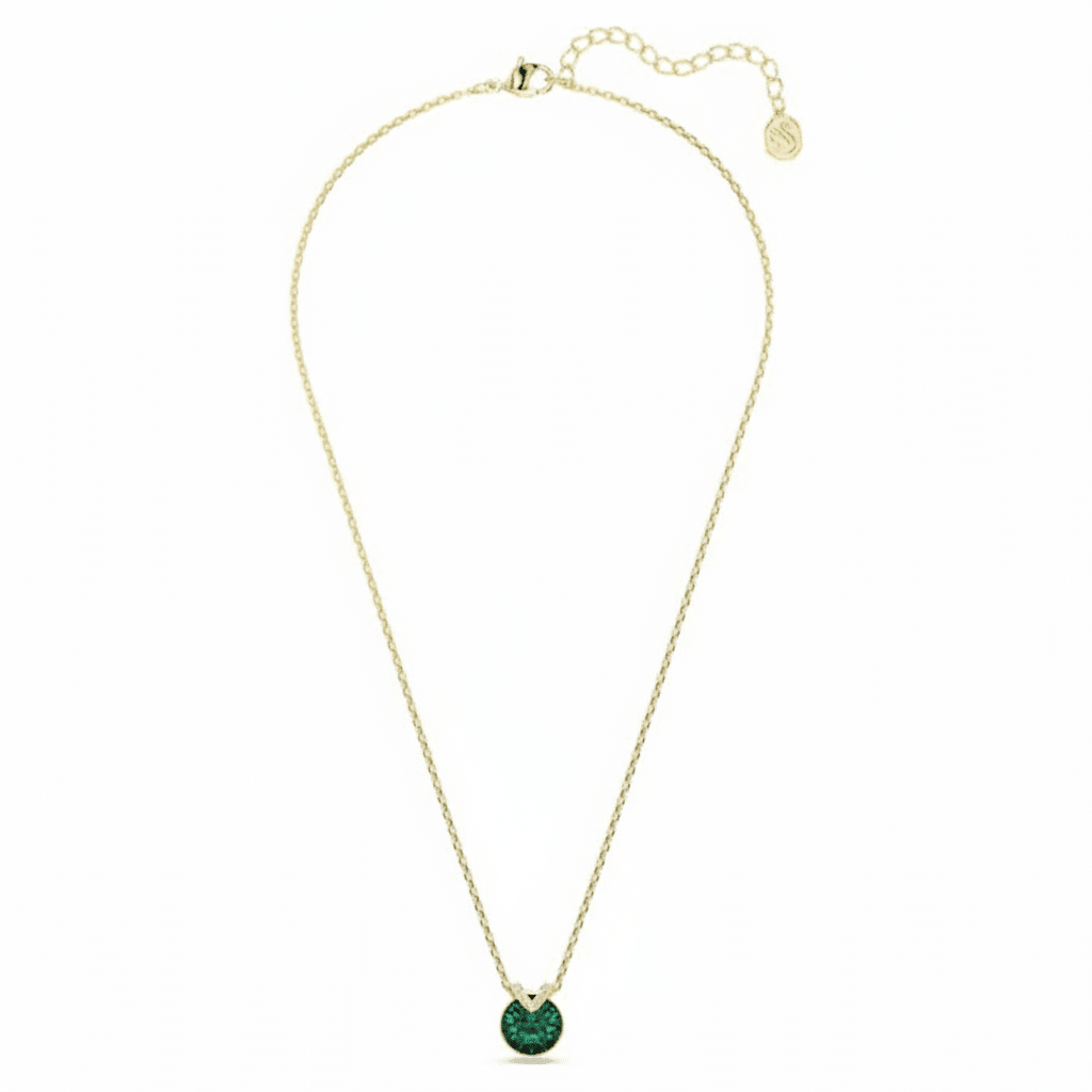 Swarovski Bella V pendant with round green crystal, gold-tone plated jewelry piece featuring a sparkling green gemstone.