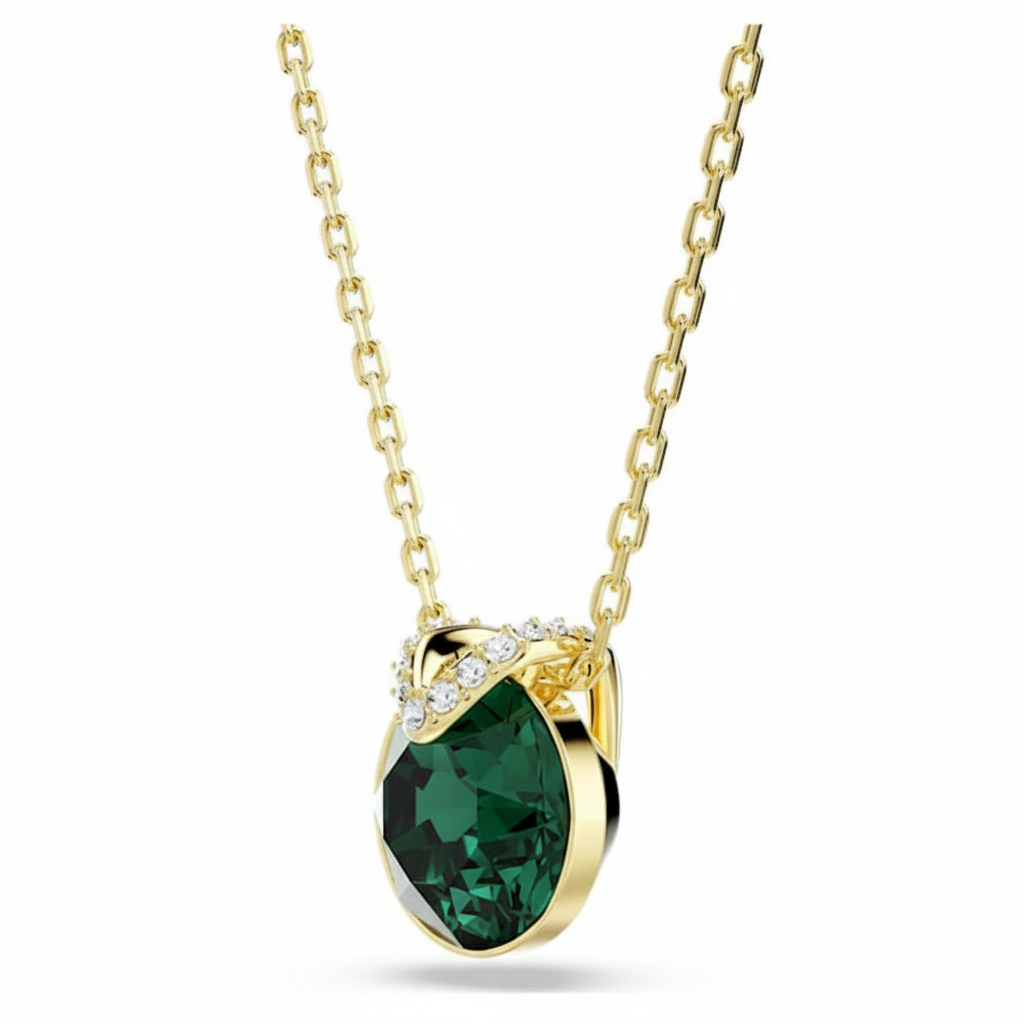 Swarovski Bella V pendant featuring a round-cut green crystal and gold-tone plated setting, elegant jewelry accessory.