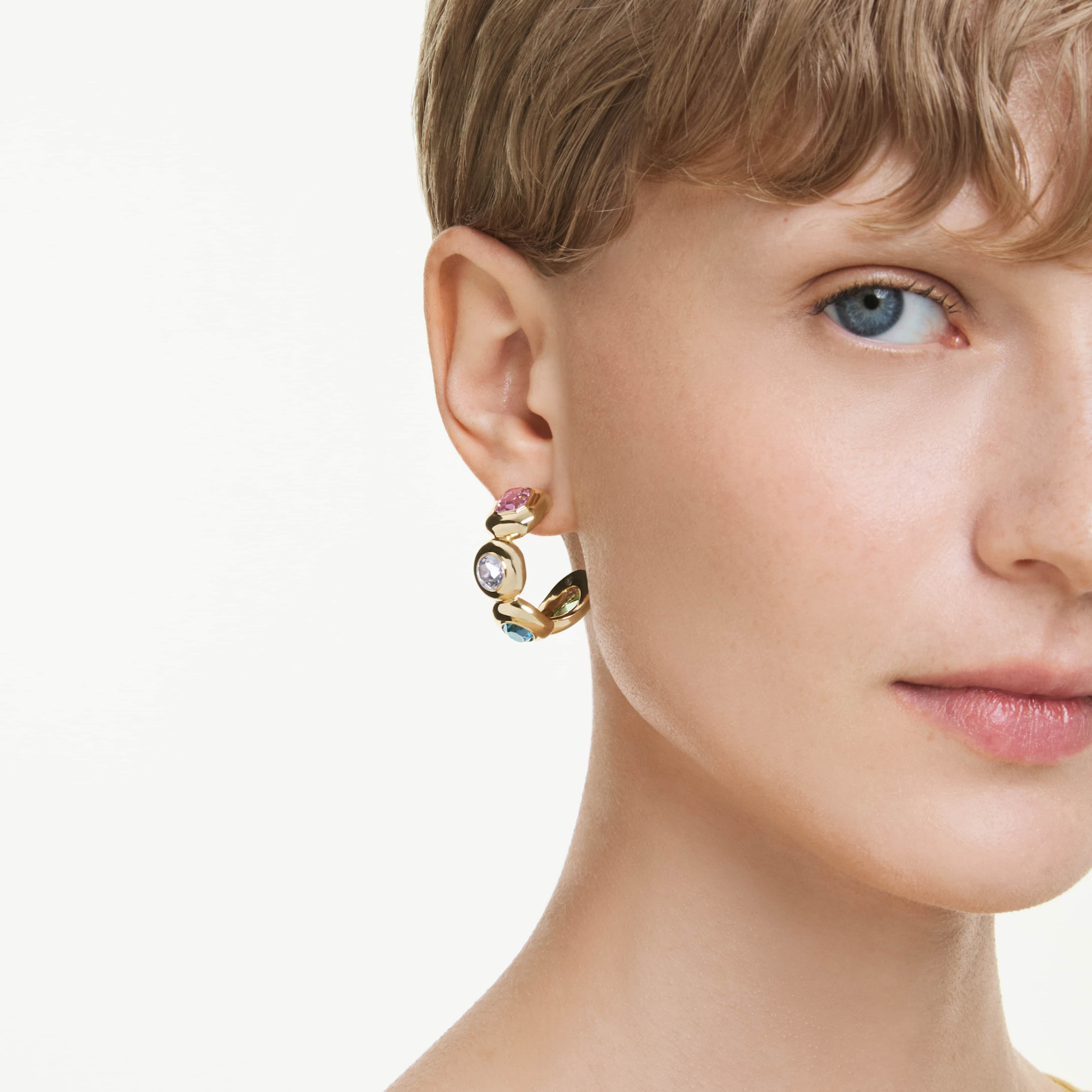 Swarovski Gema hoop earrings with multicolored mixed-cut crystals and gold-tone plating, showcasing elegant jewelry design.