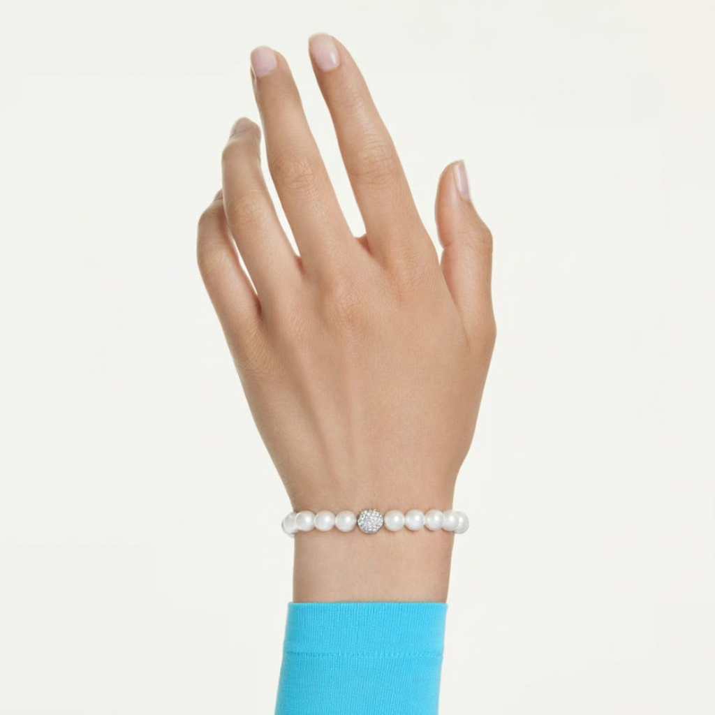 Swarovski Matrix bracelet with white crystal pearls and rhodium plating, featuring elegant, sparkling jewelry design.