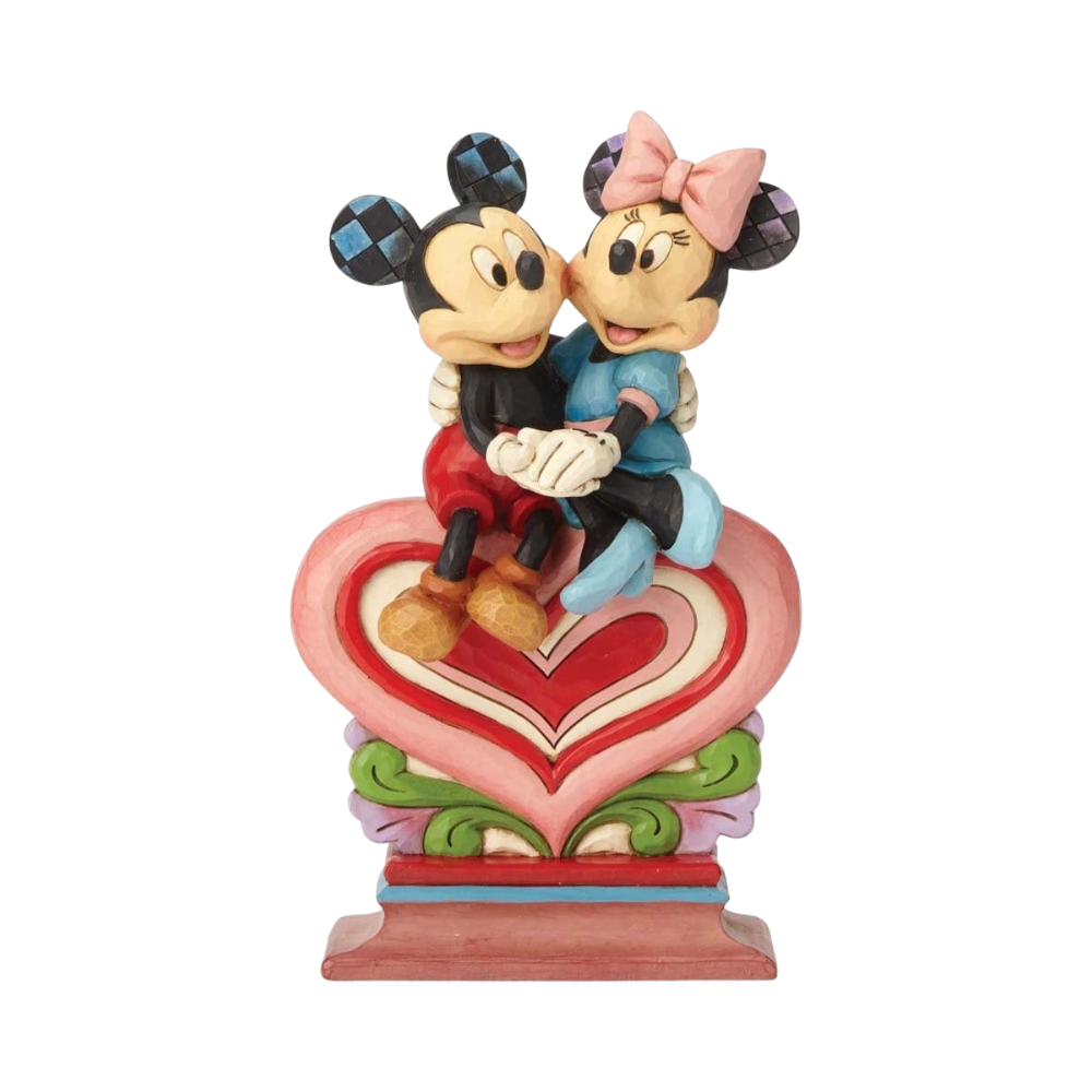 Swarovski Disney Heart to Heart Mickey Mouse and Minnie Mouse ornament on a heart-shaped display, featuring detailed crystal craftsmanship.