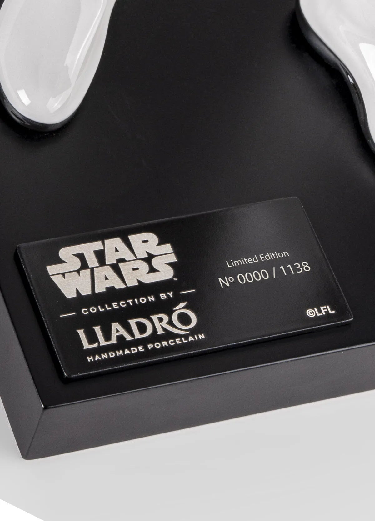 Limited edition Lladro Stormtrooper sculpture displayed on a stand, showcasing detailed craftsmanship and iconic Star Wars character.
