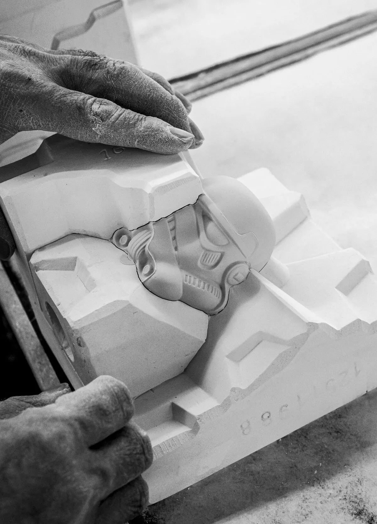Lladro Stormtrooper™ sculpture in limited edition, detailed white ceramic figure with black accents, standing in a dynamic pose.