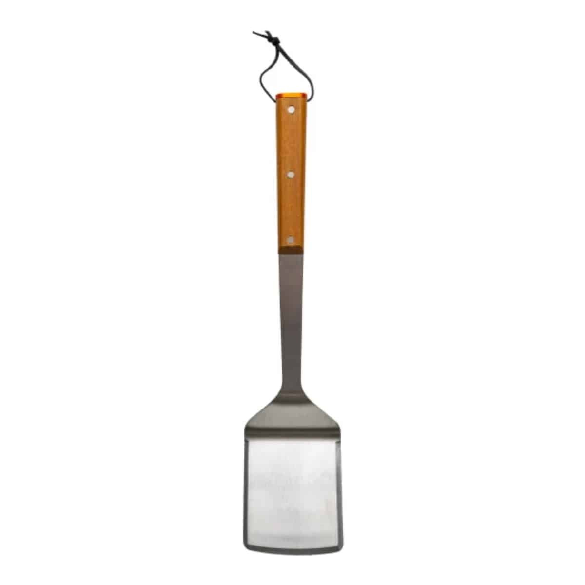 Traeger BBQ spatula with black handle and stainless steel blade, designed for grilling and flipping food on a barbecue grill.
