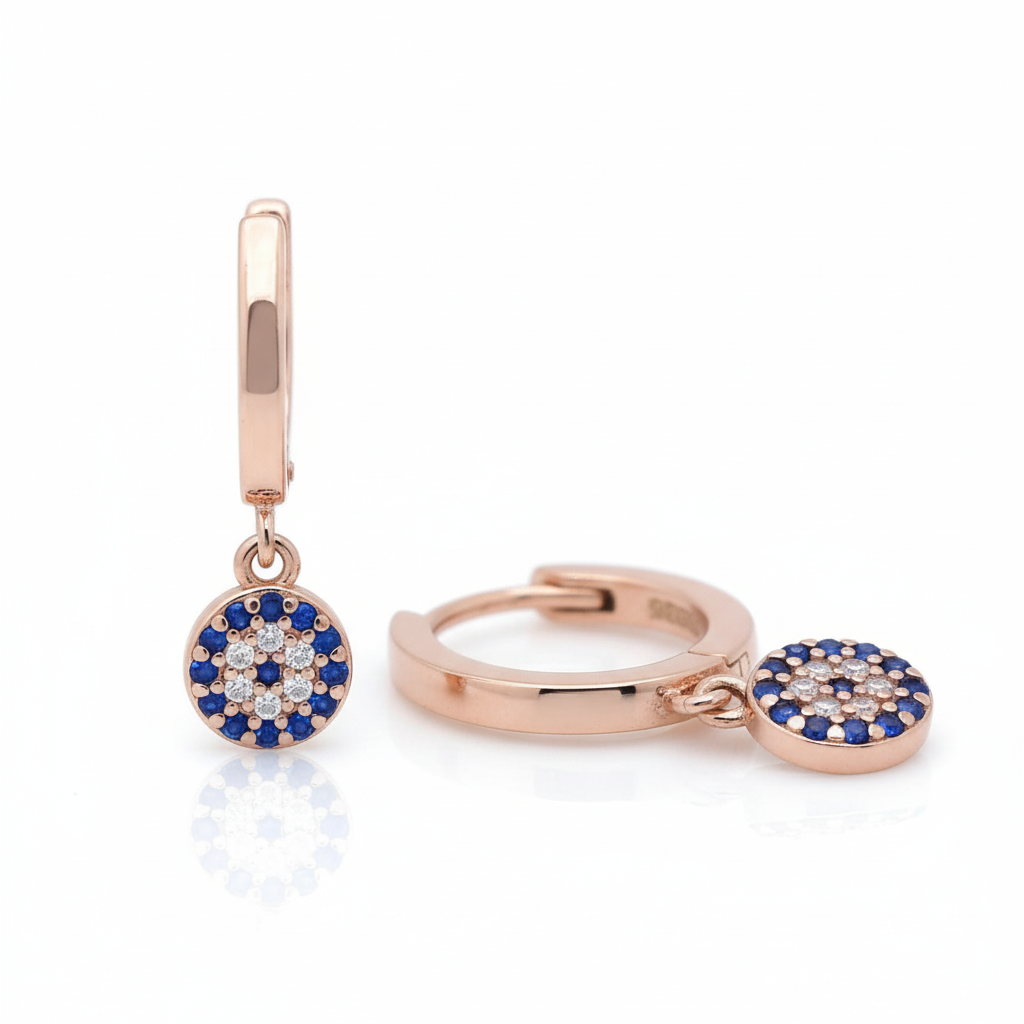 Misu Rose Gold Eye Huggies Earrings with a delicate, curved design and a shiny rose gold finish.