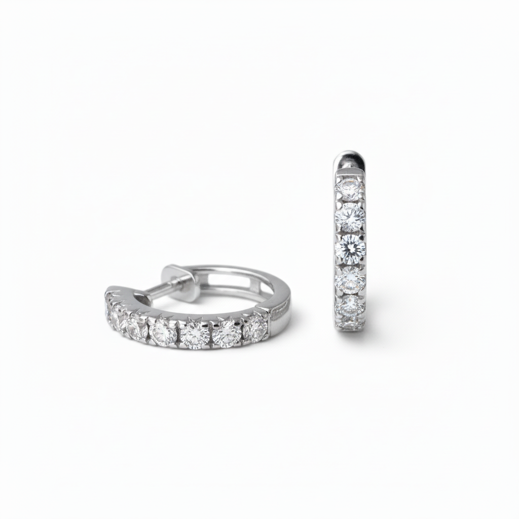 Lab Grown Diamonds 9CT white gold huggie earrings with sparkling diamond accents, showcasing elegant jewelry design.