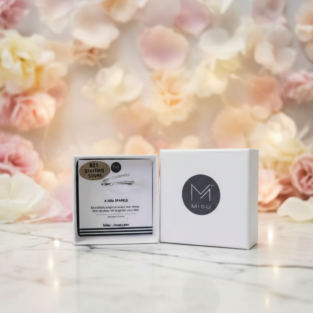 Adjustable MISU 925 sterling silver ring with a swirling design, showcasing its elegant and modern craftsmanship.