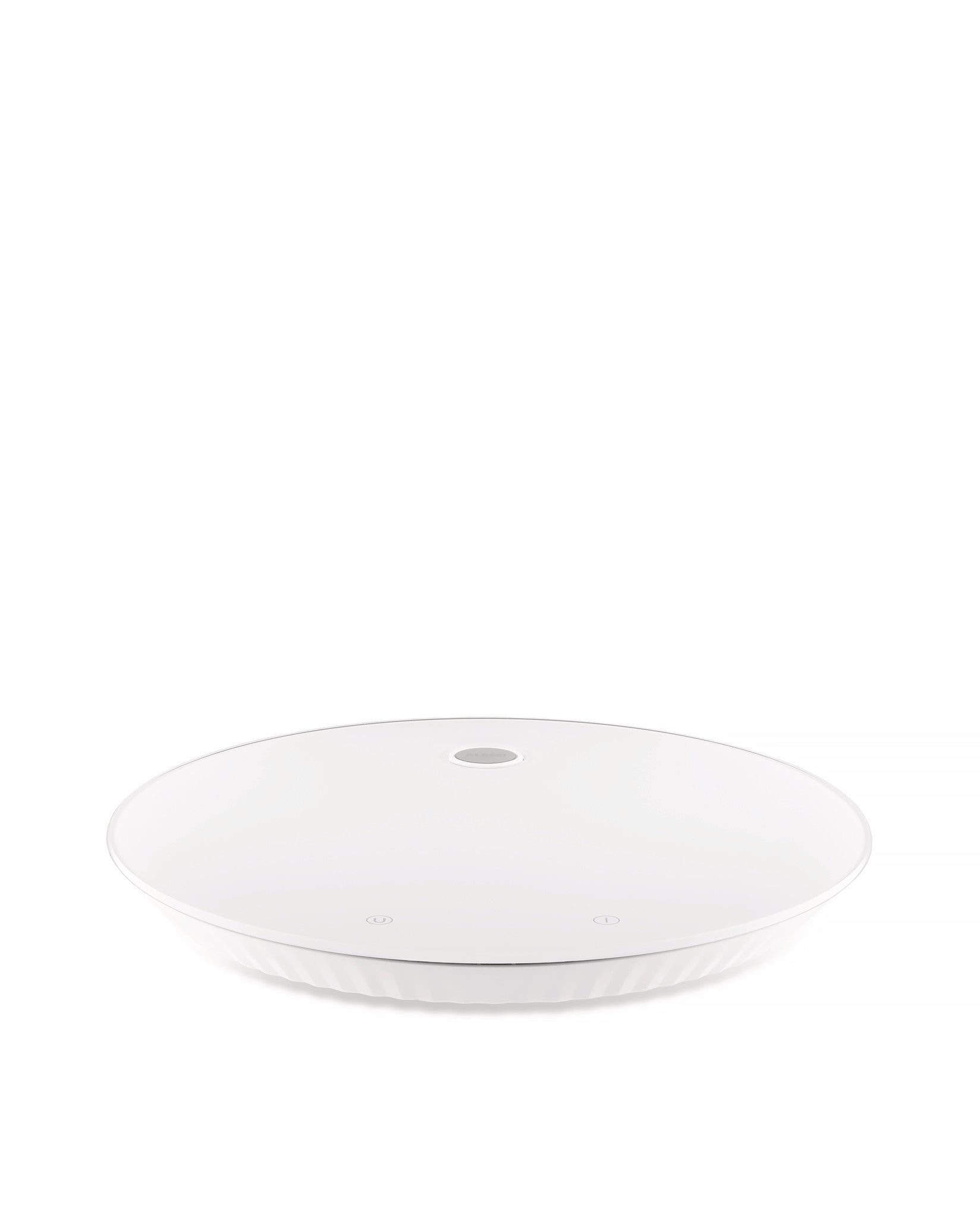 Alessi Plissé white kitchen scale with textured plissé design and digital display on a clean countertop.