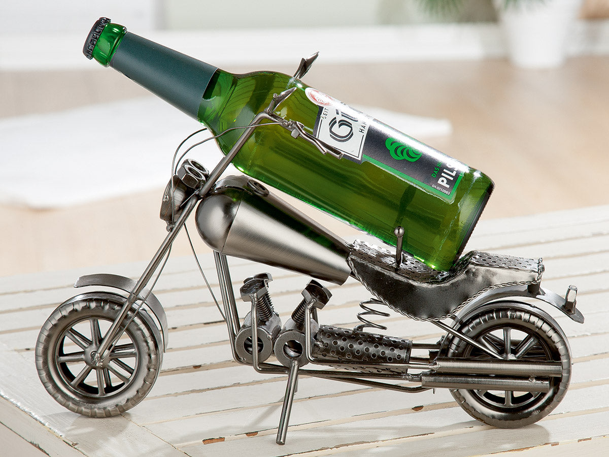 Gilde metal motorcycle bottle holder with bracket, durable steel construction, mounted on a motorcycle for secure drink storage.