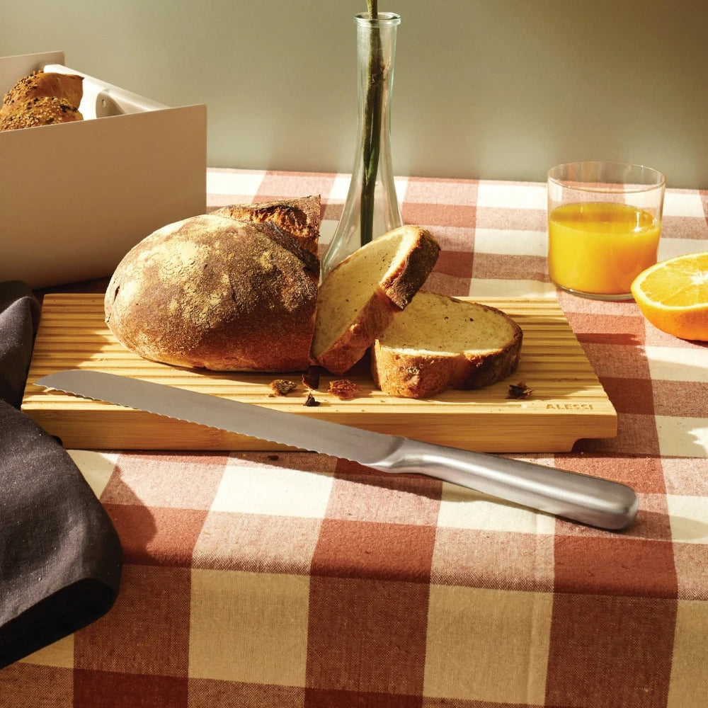 Alessi Mami bread knife with a sleek handle and serrated blade for easy slicing of bread and baked goods.