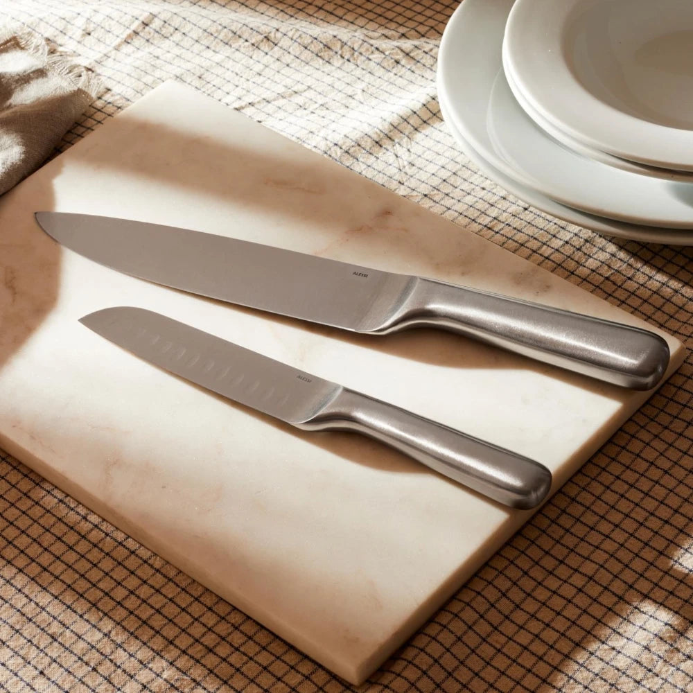 Alessi Mami kitchen knife with a sleek stainless steel blade and ergonomic handle, ideal for precise cooking tasks