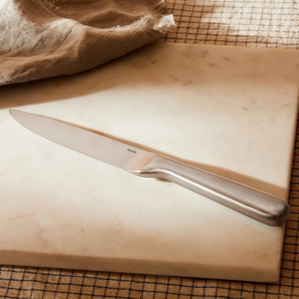 Alessi Mami multi-purpose knife with a sleek stainless steel blade and ergonomic handle, ideal for versatile kitchen tasks.