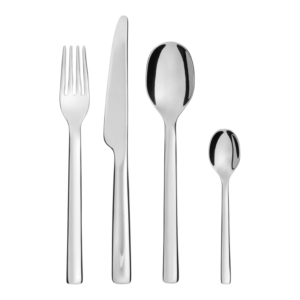 Alessi Ovale 24-piece cutlery set with stainless steel forks, knives, and spoons arranged on a table.