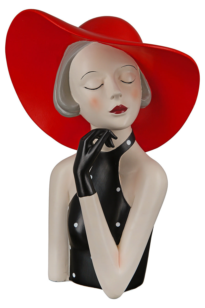 Gilde woman figure wearing a red hat and dotted dress, detailed collectible figurine with elegant pose and intricate features.