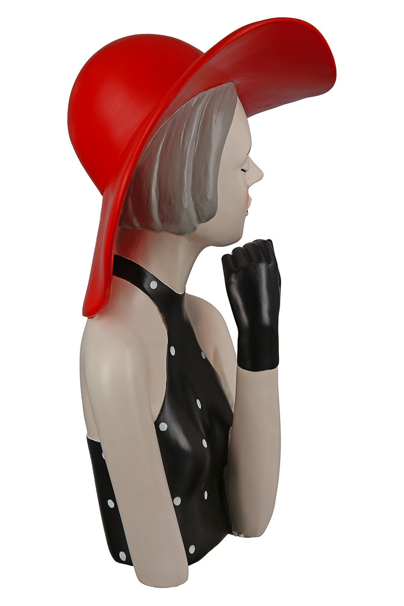 Gilde woman figure wearing a red hat and dotted dress, detailed miniature collectible figurine with stylish attire.