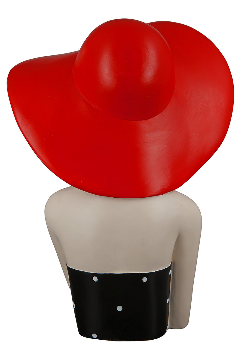 Gilde woman figure wearing a red hat with dotted pattern, detailed fashion accessory collectible doll.
