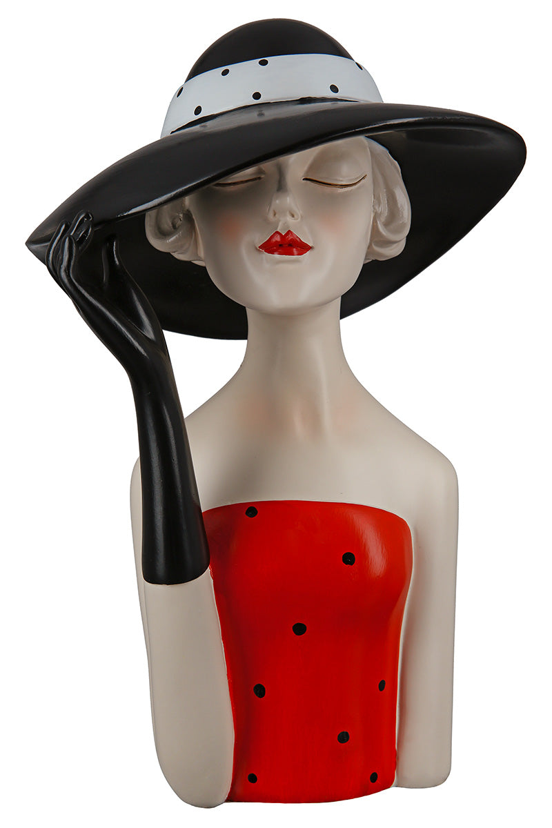 Gilde woman figurine wearing a black hat and dotted dress, detailed collectible lady figure with elegant attire.