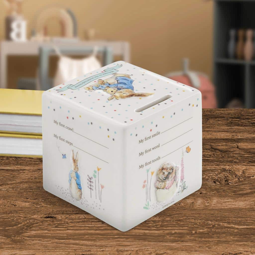 Beatrix Potter ceramic money box featuring a charming illustration, designed for children's savings and first piggy bank.