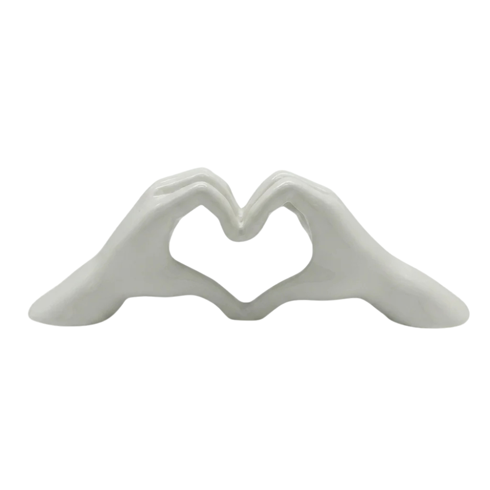 White Gilde decorative object with heart-shaped hand motif, featuring elegant design for home decor or display.