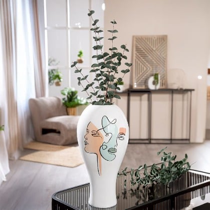 White Gilde vase with a bulbous face motif, made of resin, standing 36cm tall, featuring detailed facial features and a smooth finish.